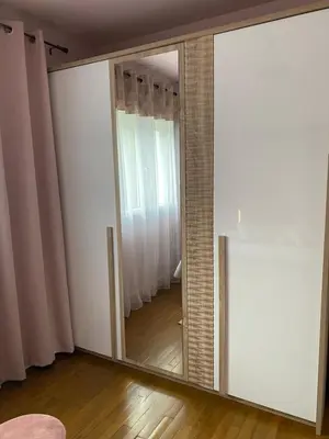 a mirror in a room with a door and a window at Maison face à la cité in Carcassonne