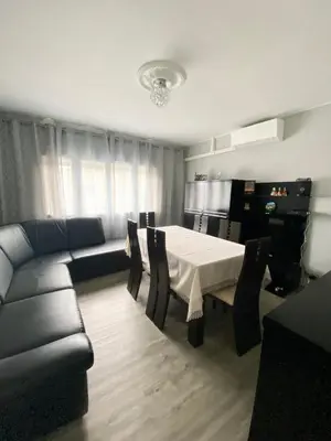 a living room with a table and a couch at Maison face à la cité in Carcassonne