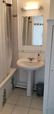 a bathroom with a sink and a mirror at Gruissan studio aux Amarines au bord de la plage du Grazel in Gruissan