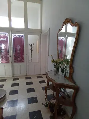 a room with a mirror and a table and windows at OCC34 - Capestang - Villa Quinlan in Capestang