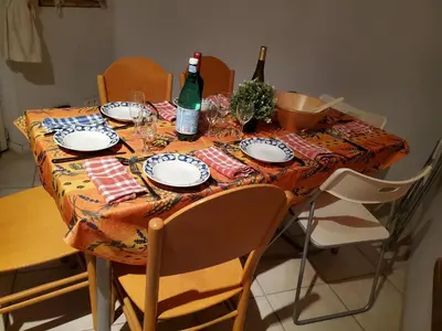 a table with two bottles of wine and glasses on it at OCC34 - Capestang - Villa Quinlan in Capestang