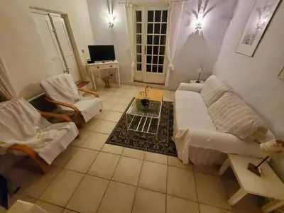 a living room with a couch and a table at OCC34 - Capestang - Villa Quinlan in Capestang