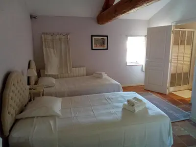 a bedroom with two beds and a window at OCC34 - Capestang - Villa Quinlan in Capestang