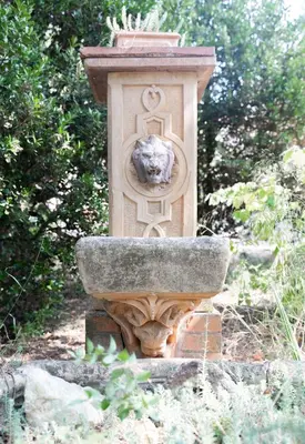 a statue of a lion on top of a fountain at Chez papy Charles in Carcassonne