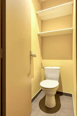 a bathroom with a white toilet in a closet at Maison du capitole in Narbonne
