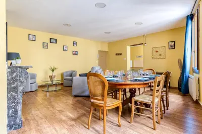 a dining room with a table and chairs at Maison du capitole in Narbonne