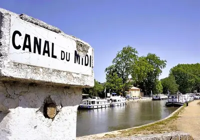 a sign that reads canal du mmo next to a river at Gîte en pleine nature - Parc, Piscine, Jacuzzi in Brézilhac