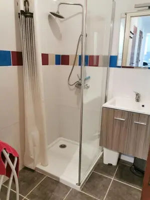 a bathroom with a shower and a sink at villa plain pied 4 chambres à 100m de la plage in Port-la-Nouvelle
