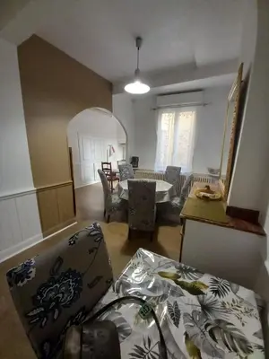 a living room with a couch and a table at La Maison de Chouquette in Limoux