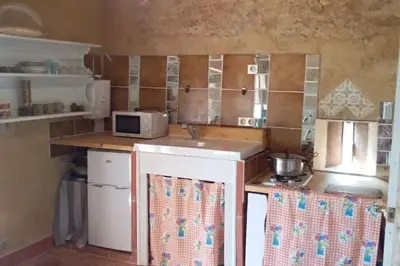 a small kitchen with a sink and a microwave at la Bergerie in Salles-sur-lʼHers