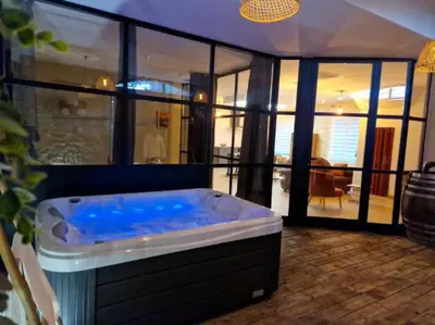 a jacuzzi tub in the middle of a room at Gîte « domaine de l’oustal nau » in Peyriac-de-Mer