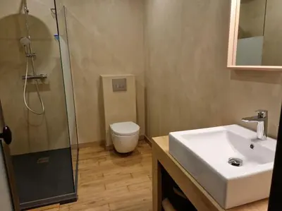 a bathroom with a sink and a shower and a toilet at Gîte « domaine de l’oustal nau » in Peyriac-de-Mer