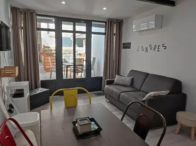 a living room with a couch and a table at Le Gabin Moderne Loft in Carcassonne