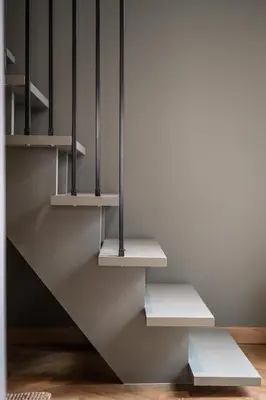 a staircase with white shelves in a room at La Maison de Jean by Maison Bacou in Carcassonne