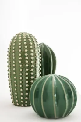 two green vases sitting next to each other at La Maison de Jean by Maison Bacou in Carcassonne