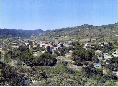 an aerial view of a small town with houses and trees at La maison d' Anne , nature et convivialité ... in Albas