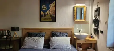 a bathroom with a sink and a mirror at LA CHAMBRE DU CANTOU in Lautrec