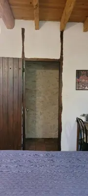 a room with a wooden door in a room at LA CHAMBRE DU CANTOU in Lautrec