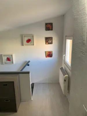 a white room with a desk and a window at L appart d Ange 2 idealement situe 47m2 entre le port et le village in Gruissan