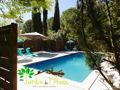 a swimming pool with a deer stencil on the side at Chambre Indépendante Piscine, Parc, Cuisine... in Brézilhac