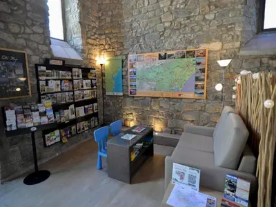 a room with a couch and a map on the wall at Residence du Château de Jouarres, Azille - Studio 2 pers with balcony in Azille