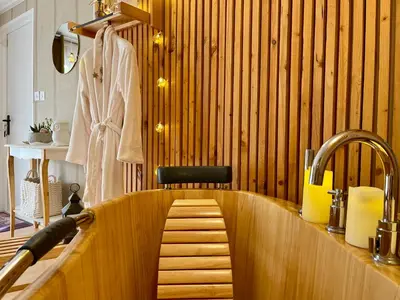 a kitchen with a wooden tub with a sink at Gîte Les logis du Pech in Narbonne