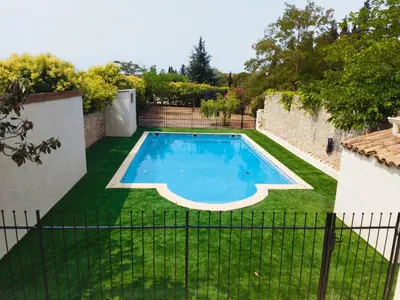 a swimming pool in the yard of a house at Aur Blan - Les Pipistrelles in Le Somail