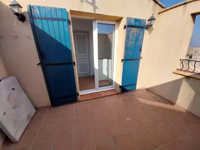an open door with a mirror on a building at centre historique et proche mer in Sigean