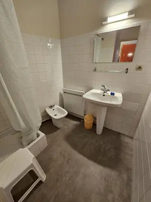a bathroom with a sink and a toilet at Résidence Anclo in Rennes-les-Bains