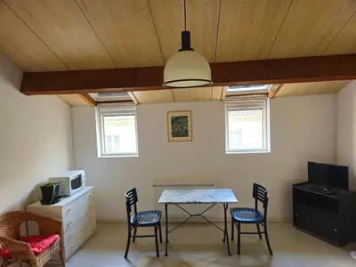 a dining room with a table and two chairs at Résidence Anclo in Rennes-les-Bains