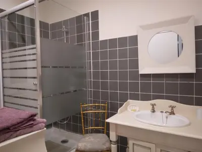 a bathroom with a sink and a mirror at Beausejour in Lézignan-Corbières