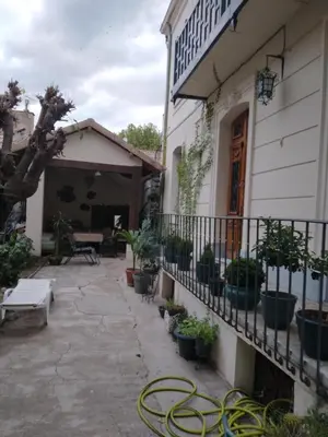 a patio outside of a building with potted plants at Beausejour in Lézignan-Corbières