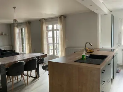 a kitchen with a large island with a sink at NATURE by Reine du Sud, proche des Grands Buffets in Narbonne