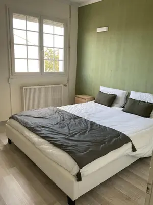 a large white bed in a room with a window at NATURE by Reine du Sud, proche des Grands Buffets in Narbonne