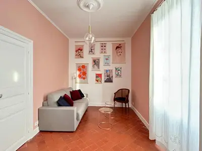 a living room with a couch and a chair at Domaine de Lanis - Chambres d'hôtes avec parc et piscine in Castelnaudary