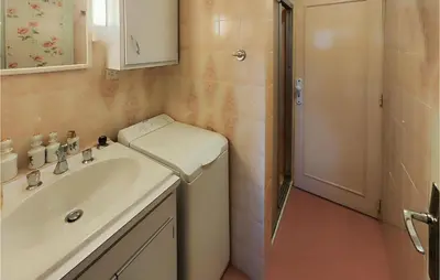 a bathroom with a sink and a shower at 2 Bedroom Cozy Home In Cébazan in Cébazan