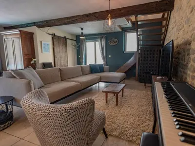 a living room with a couch and a piano at Lécurie in Montréal