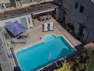 an overhead view of a swimming pool with an umbrella at Lécurie in Montréal