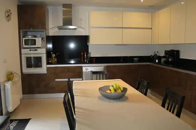 a kitchen with a table with a bowl of bananas on it at Villa Félines in Félines-Minervois