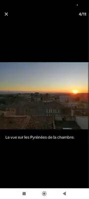 a picture of a sunset in a city at Charmant T2 refait à neuf, au cœur de Puylaurens in Puylaurens