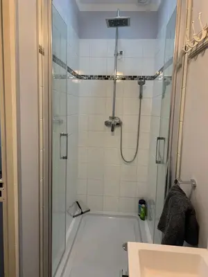 a bathroom with a shower and a bath tub at La Maison du Magistrat in Durban-Corbières