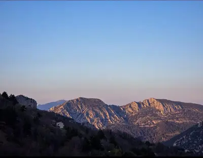 a bedroom with a window with a view of a mountain at Salvezines Villa in Salvezines