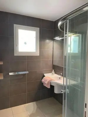 a bathroom with a sink and a glass shower at Salvezines Villa in Salvezines