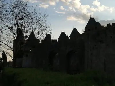 an old castle with a bunch of turrets at Le soleil d Eugènie appartement dans résidence avec Piscine commune près de Carcassonne in Olonzac