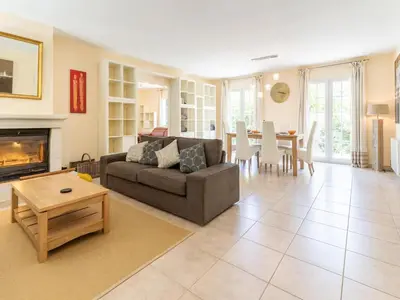 a living room with a couch and a table at Charming Villa Stay Near Limoux in Limoux