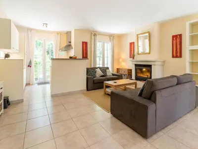 a living room with a couch and a fireplace at Charming Villa Stay Near Limoux in Limoux