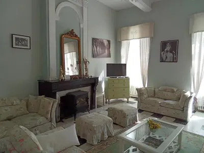 a bedroom with a bed and a dresser and a mirror at OCC34 - Capestang - Manoir in Capestang