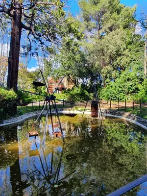 a pool of water in a park at Gîte du parc à Langel in Armissan