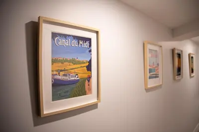 a picture hanging on a wall in a room at La maison rue Nadaud, au pied des remparts in Carcassonne