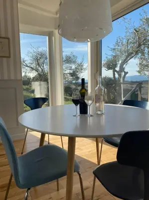 a table with two bottles and two glasses of wine at Neuve Romantique in Montbrun-des-Corbières